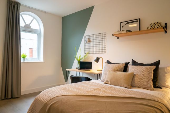 A Stylish And Inviting Double Bedroom Featuring Am...