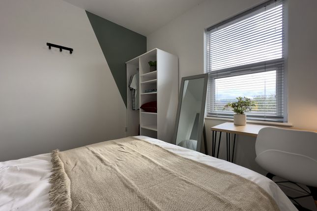 A Bright And Inviting Double Bedroom Featuring Mod...