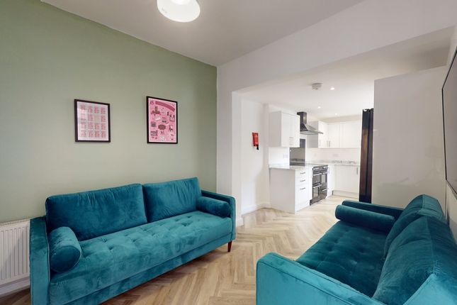 A Spacious And Stylish Modern Living Room Featurin...