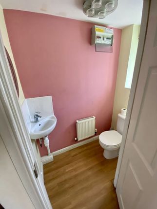 A Compact And Tidy Single Toilet Featuring A Moder...