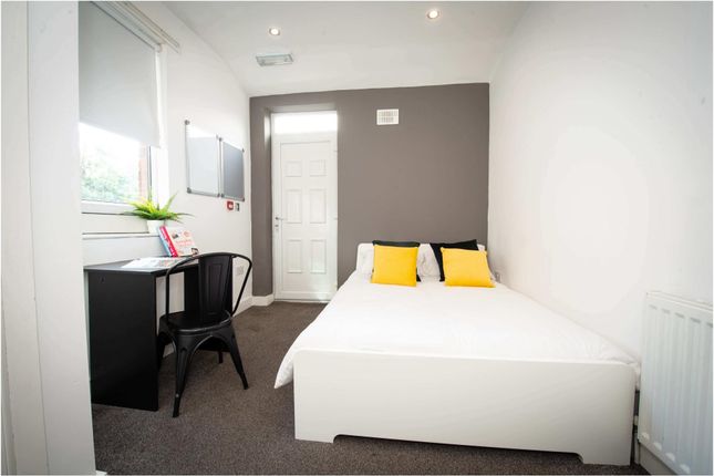 A Bright And Modern Master Bedroom Featuring A Com...