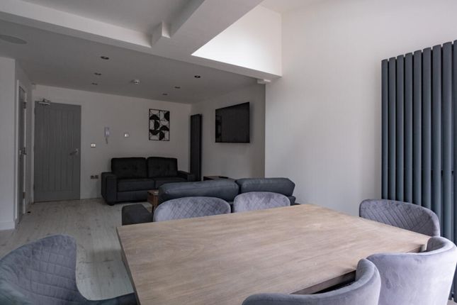 A Stylish And Contemporary Living Room Featuring c...
