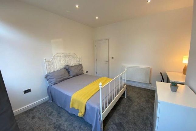 A Bright And Welcoming Master Bedroom Featuring A ...