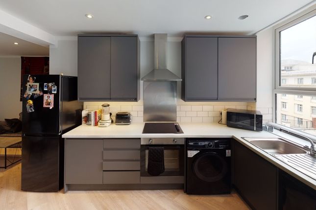 A Modern And Bright Kitchenette Featuring Sleek Ca...