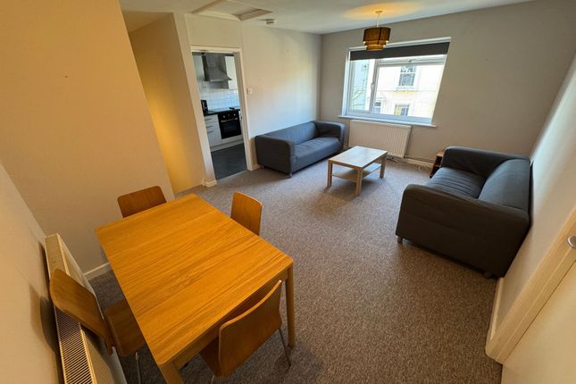 Bright And Welcoming Living Room Featuring Two Com...