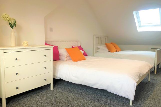 A Bright And Welcoming Double Bedroom Featuring Tw...