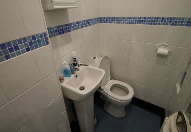 A Clean, Well-Maintained Bathroom Featuring A Toil...