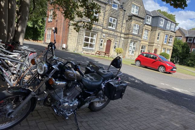 Exterior View Of A Historic Stone Building With We...