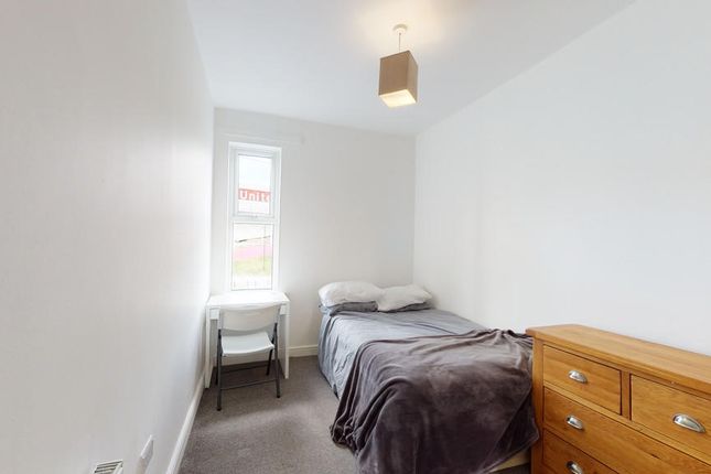 Cozy Single Bedroom With A Comfortable Bed, A Smal...