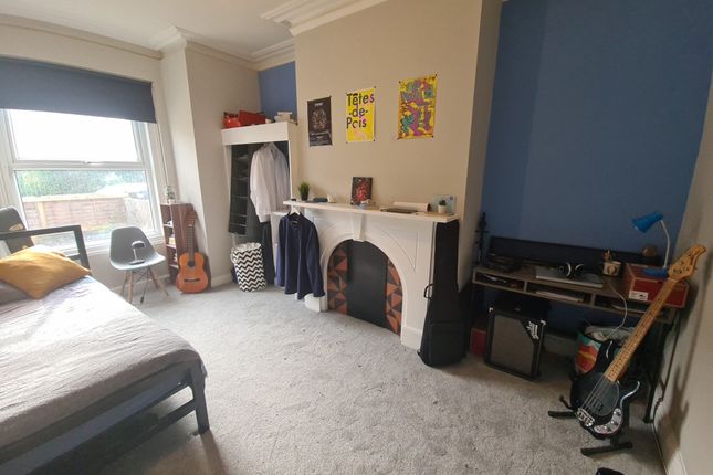 A Spacious And Inviting Master Bedroom Featuring A...