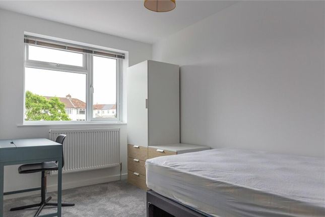 A Clean And Simple Single Bedroom Featuring A Larg...