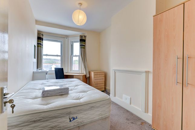 A Bright And Inviting Master Bedroom With A Large ...