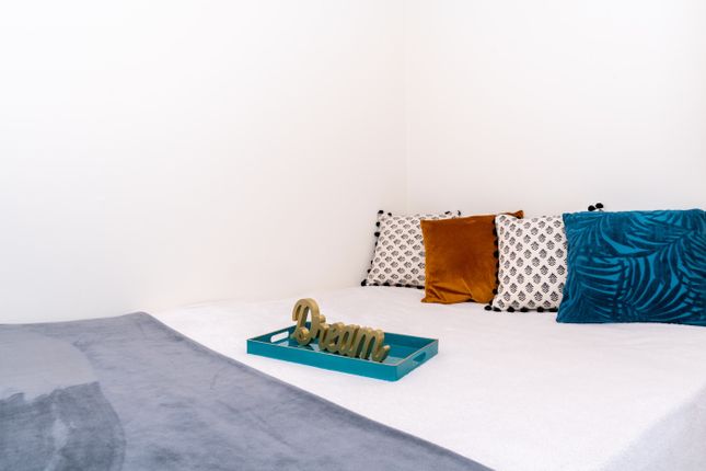 This Cozy Double Bedroom Features A Spacious Layou...