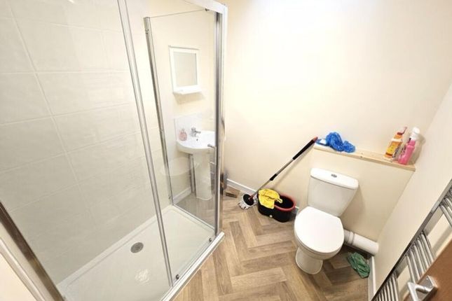 Bright And Clean Bathroom Featuring A Modern Walk-...