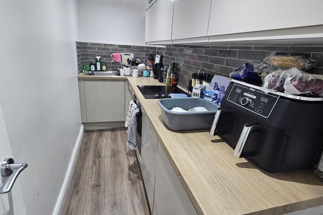 A Modern Kitchen Area Featuring A Functional Layou...