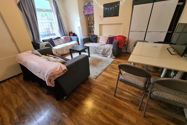 Bright And Welcoming Living Room Featuring Comfort...