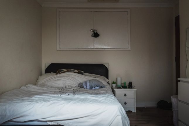 Cozy Single Bedroom Featuring A Neatly Made Bed, B...
