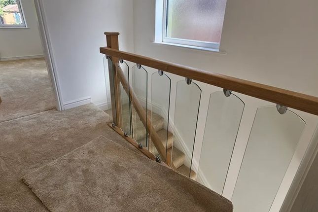A Stylishly Designed Staircase Featuring Elegant G...
