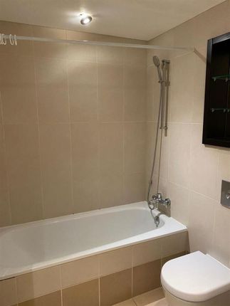 A Clean And Modern Bathroom Featuring A Full-Sized...