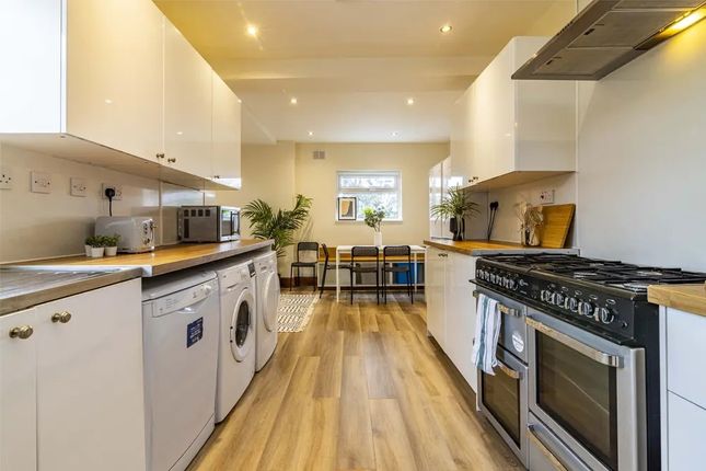 Bright And Modern Kitchen Featuring Ample Countert...