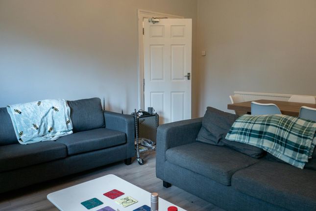 A Modern, Well-Maintained Living Room Featuring Tw...