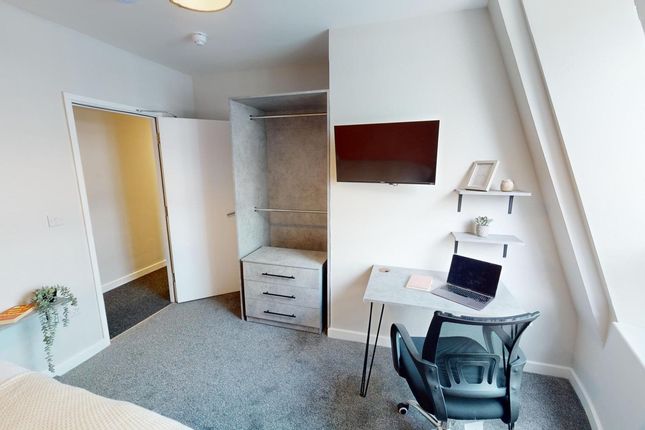 A Bright And Tidy Double Bedroom Featuring A Comfo...