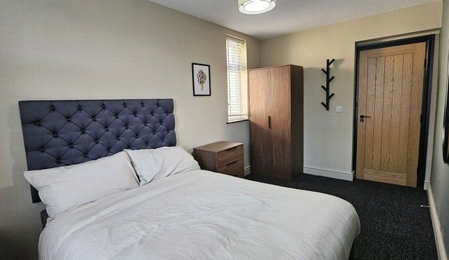 A Clean And Well-Kept Double Bedroom Featuring A c...