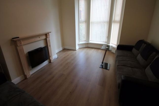 Bright Living Room With A Bay Window Letting In Na...