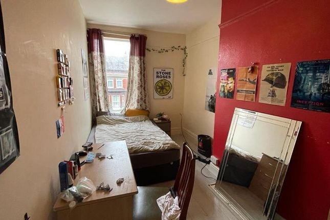 A Cozy Double Bedroom Featuring A Comfortable Bed ...