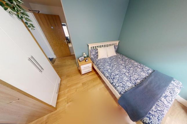 A Cozy And Clean Single Bedroom With A Stylish Des...