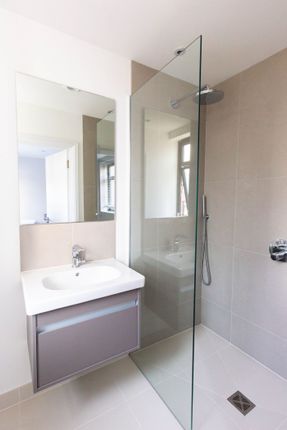A Modern And Stylish Bathroom Featuring A Sleek Sh...