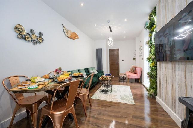 A Contemporary Living Room Featuring A Stylish Din...