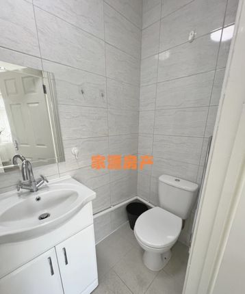 A Clean And Modern Small Bathroom Featuring A Whit...