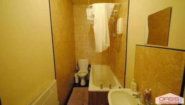 A Spacious And Well-Maintained Bathroom Featuring ...