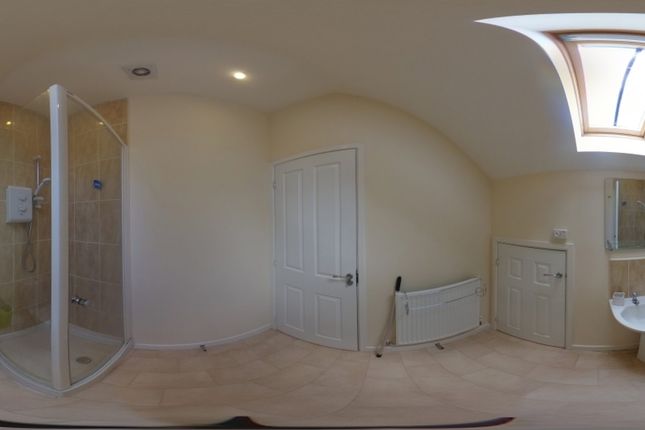 A Bright And Modern Bathroom Featuring A Spacious ...