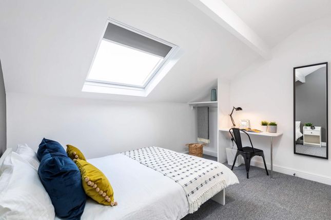 Bright, Contemporary Attic Bedroom With A Comfy Do...