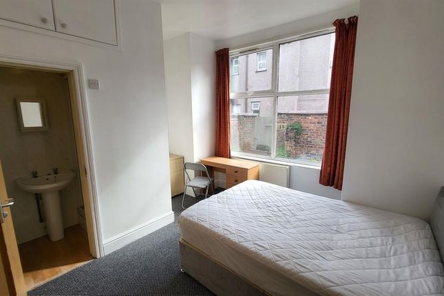 Bright Double Bedroom Featuring A Large Window Tha...