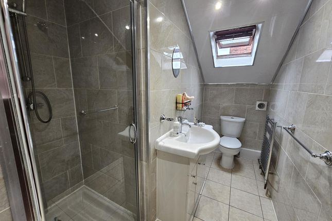 A Modern, Well-Maintained Bathroom Featuring A Sho...