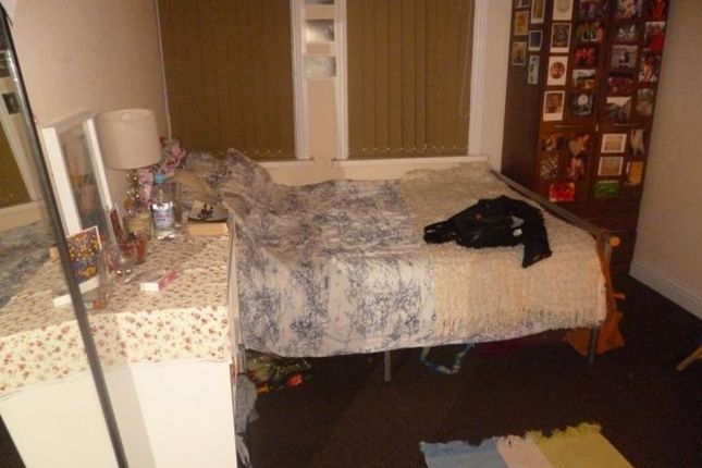 A Compact Bathroom With Basic Fixtures, Featuring ...