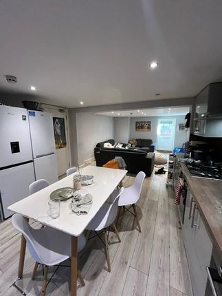 Bright And Modern Living Area Featuring A Cozy Sea...