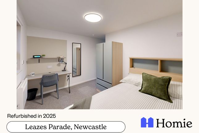 A Bright And Inviting Bedroom Featuring A Neatly m...