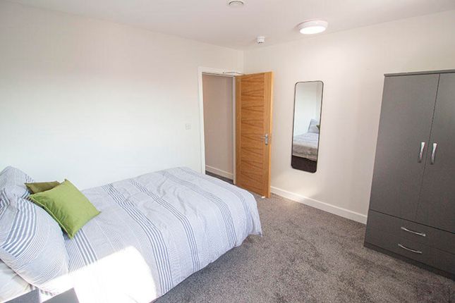 This Inviting Double Bedroom Features A Comfortabl...