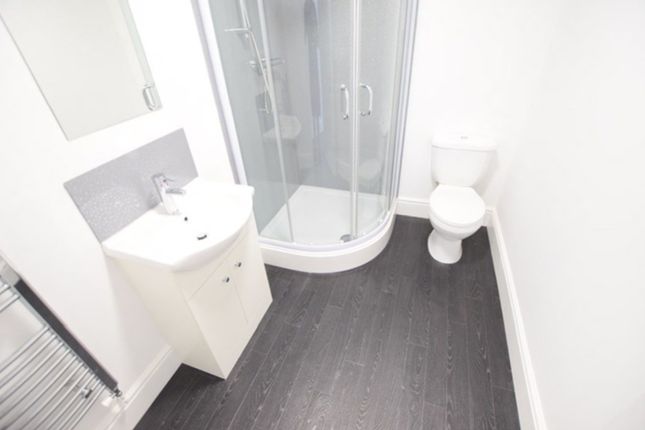 A Modern And Clean Bathroom Featuring A Stylish Sh...