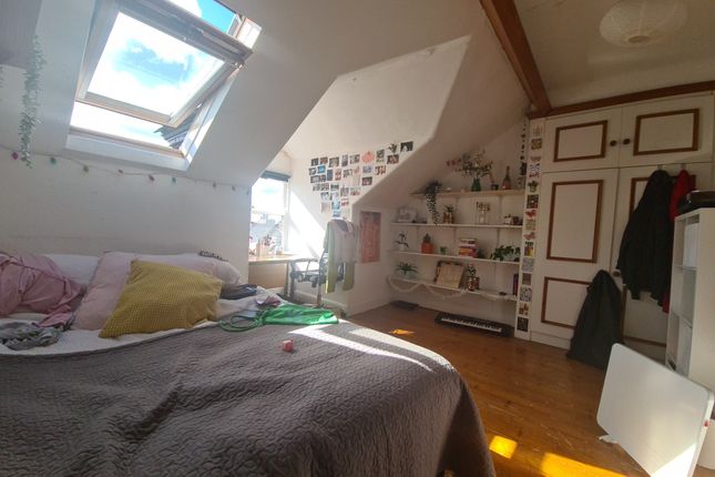 A Bright And Cozy Master Bedroom Featuring A Large...