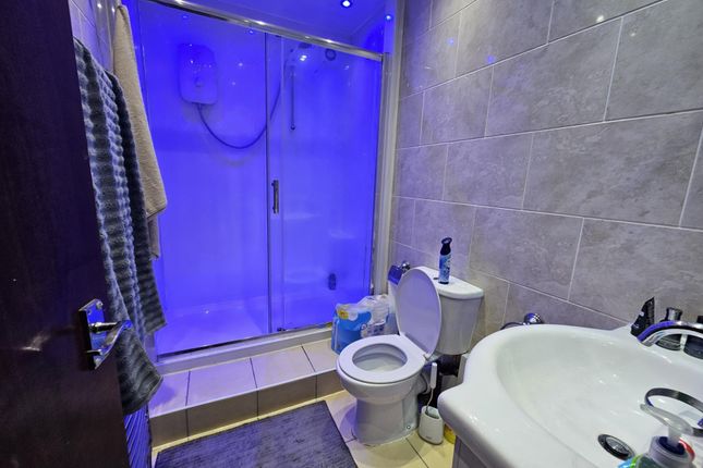 A Modern Bathroom Featuring A Large Shower With A ...