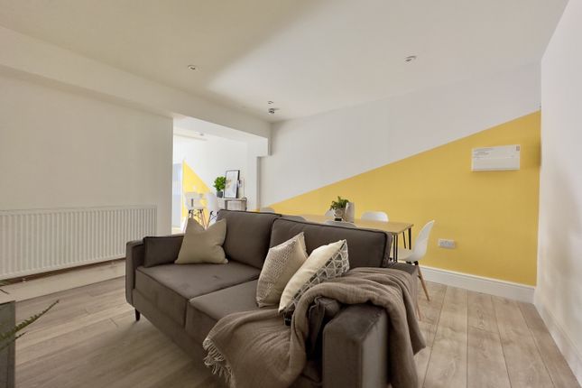 A Bright And Inviting Large Modern Living Room, Pe...