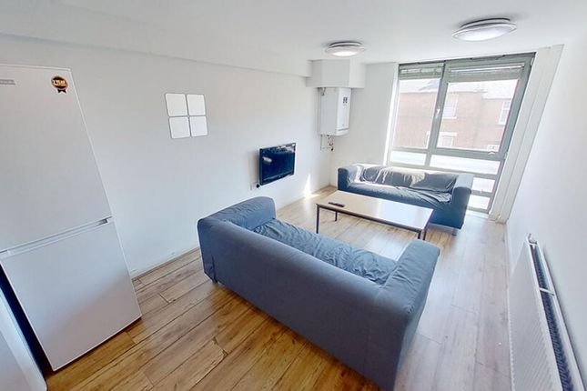 Bright And Inviting Living Room Featuring Modern F...