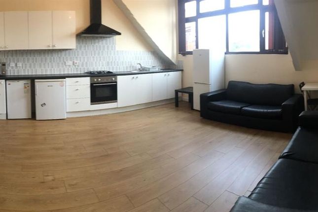 A Modern And Spacious Living Room Featuring A Comf...