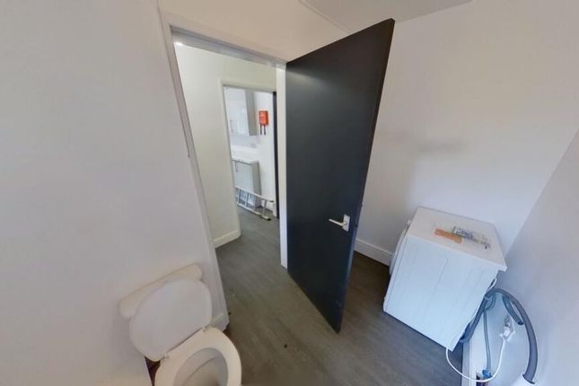 A Clean And Simple Single Toilet Room With White W...