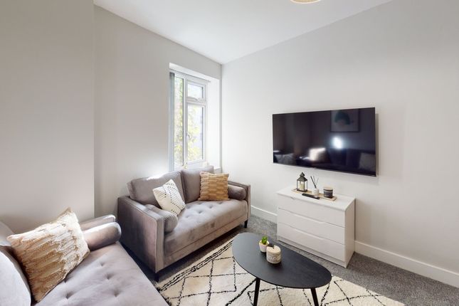 A Bright And Inviting Living Room With Modern Deco...